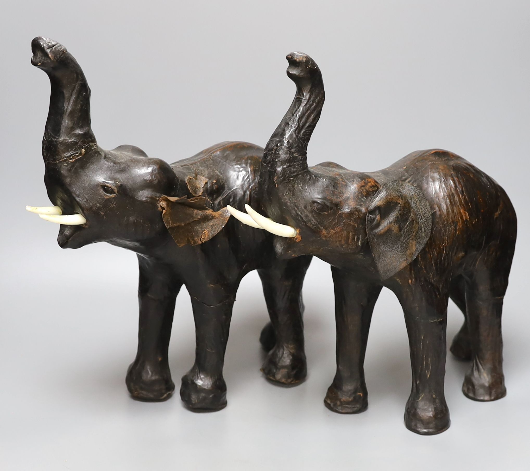 A pair of Liberty style leather mounted elephants - 36cm tall